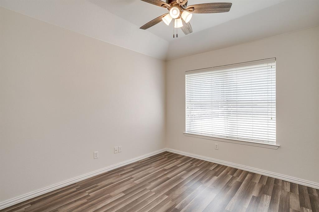 209 Cooperstown Drive Springtown, TX 76082 - Photo 31 of 40 Unfurnished room featuring wood finished floors, a ceiling fan, and lofted ceiling