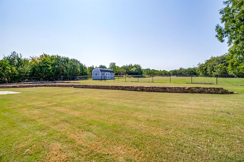 209 Cooperstown Drive Springtown, TX 76082 - Photo 38 of 40 View of yard featuring an outdoor structure