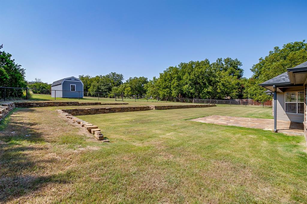 209 Cooperstown Drive Springtown, TX 76082 - Photo 39 of 40 View of yard with a patio