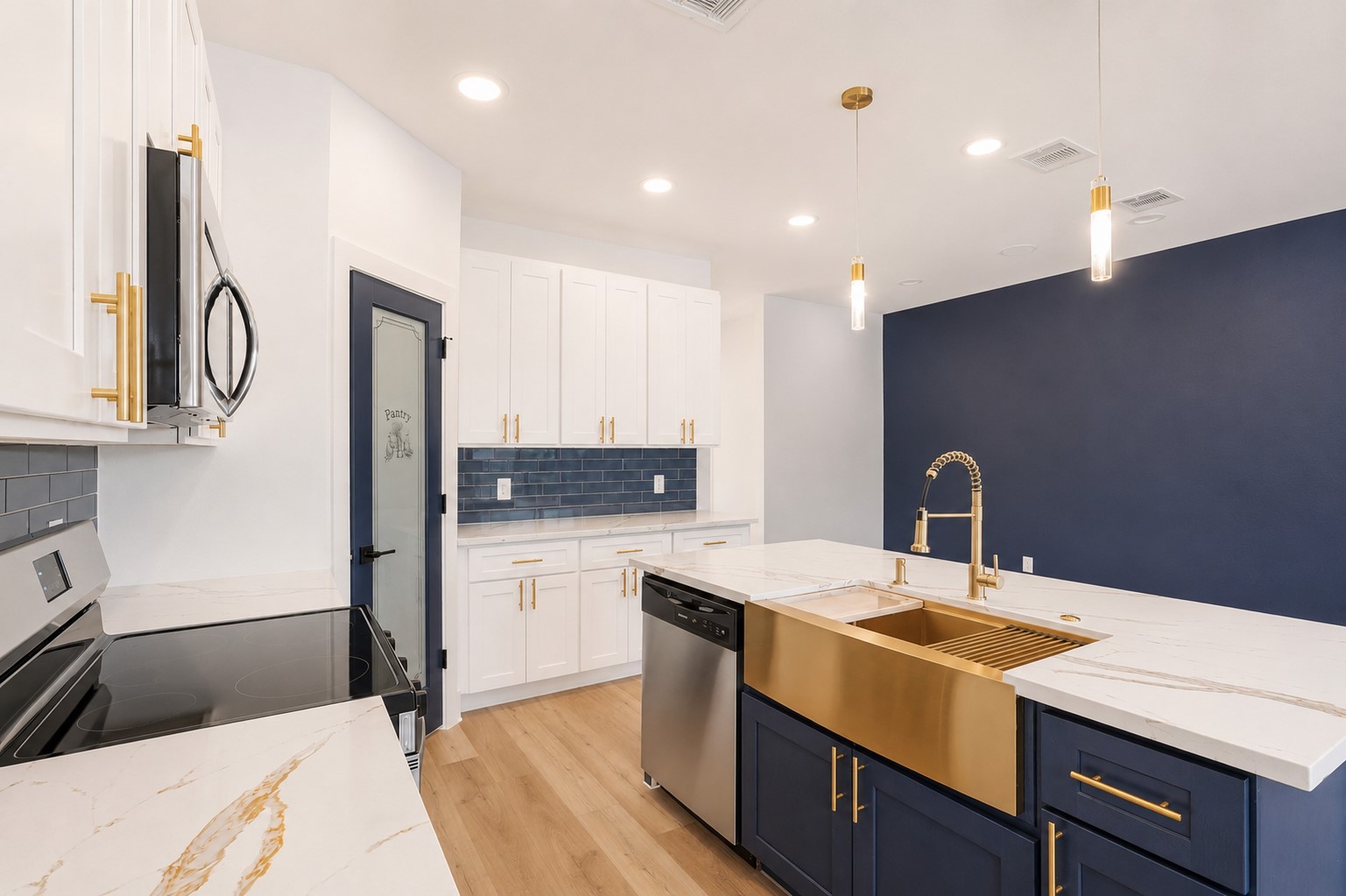 4606 Mallow Street, Unit B Houston, TX 77051 - Photo 9 of 25 a kitchen with a sink a refrigerator and cabinets