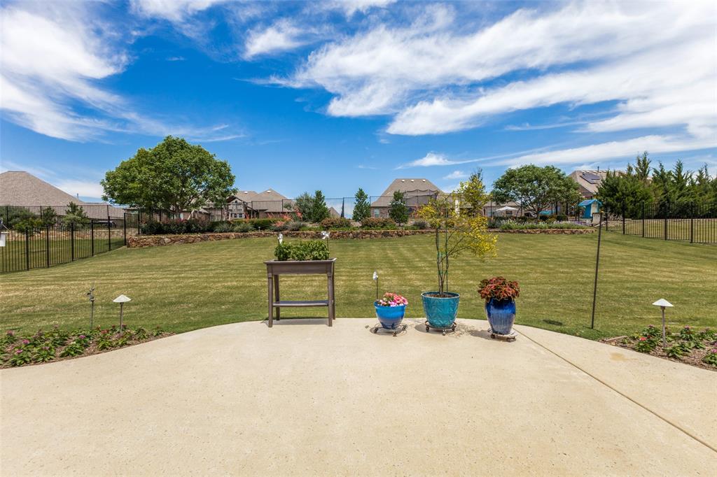 506 Life Spring Drive Rockwall, TX 75087 - Photo 32 of 36 a view of a lake with a yard