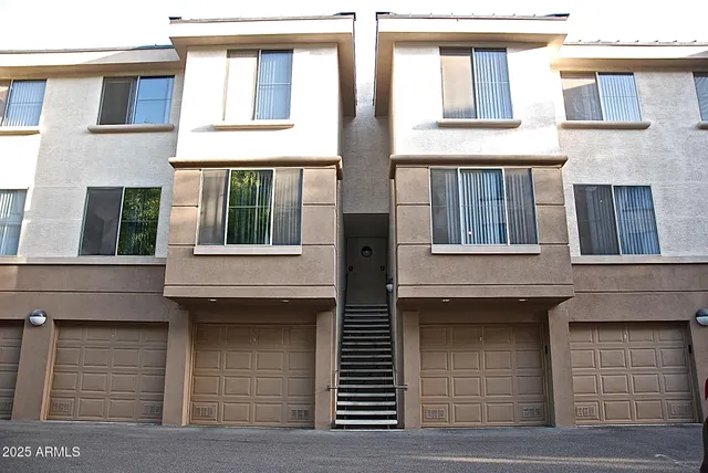 a front view of a house with a garage