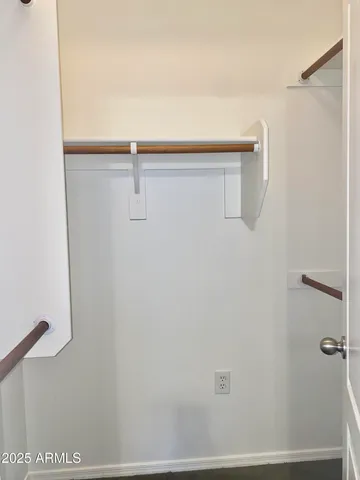 a bathroom with a granite countertop toilet and a shower