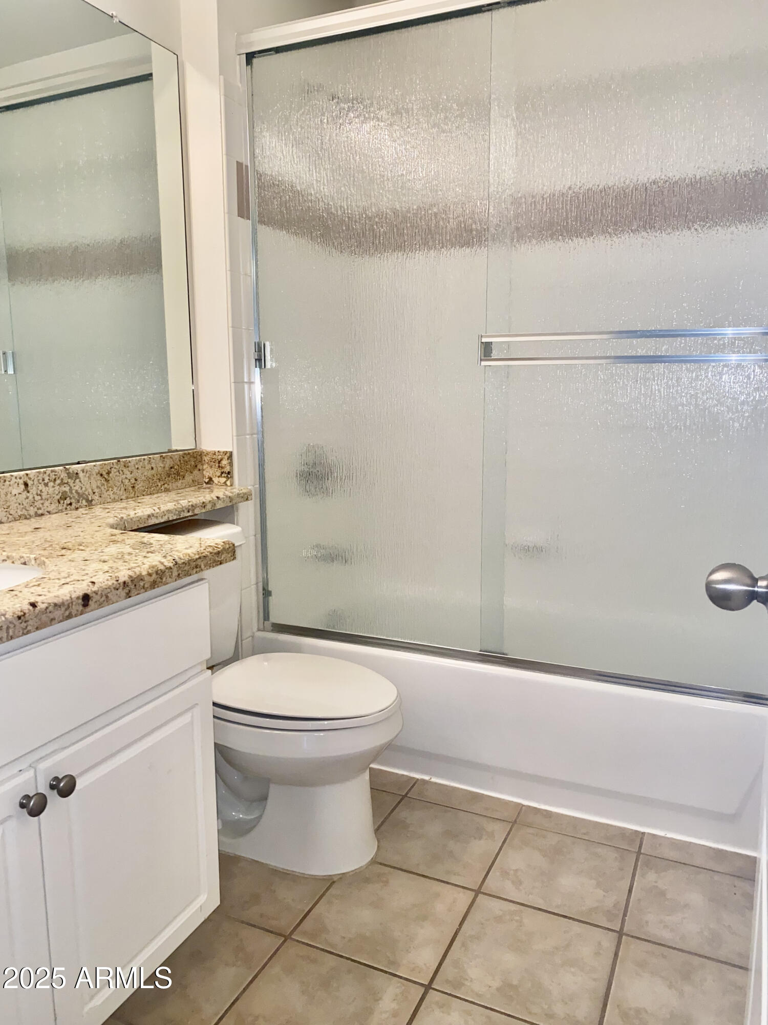 1701 East Colter Street, Unit 1 Phoenix, AZ 85016 - Photo 14 of 17 a bathroom with a granite countertop toilet and a shower