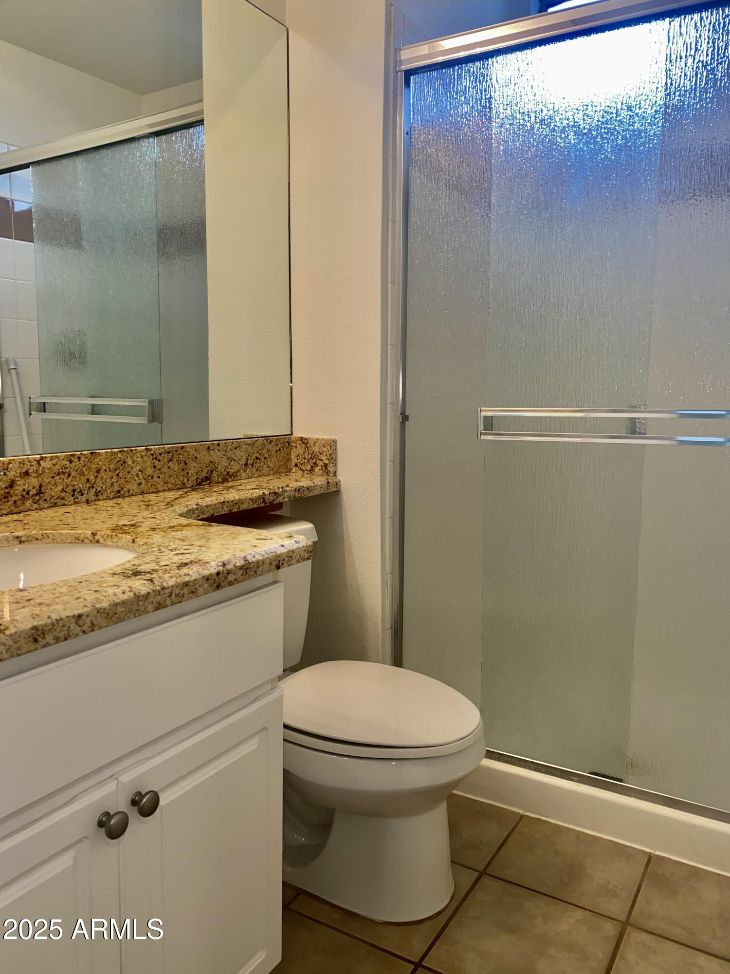 1701 East Colter Street, Unit 1 Phoenix, AZ 85016 - Photo 17 of 17 a bathroom with a granite countertop sink toilet and shower