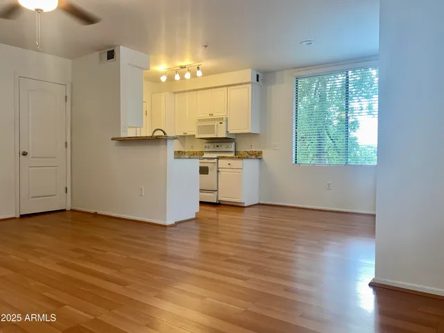 a view of a kitchen from the hallway