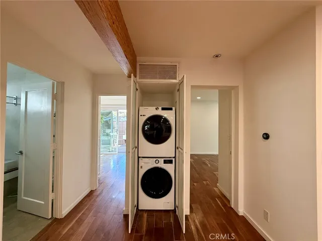 a view of a hallway with washer and dryer