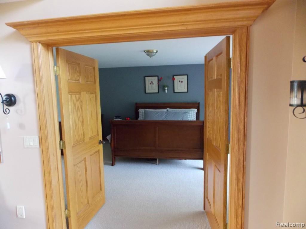2974 Hannan Road Imlay City, MI 48444 - Photo 18 of 45 Oak French doors leading to the large 1st floor master bedroom.