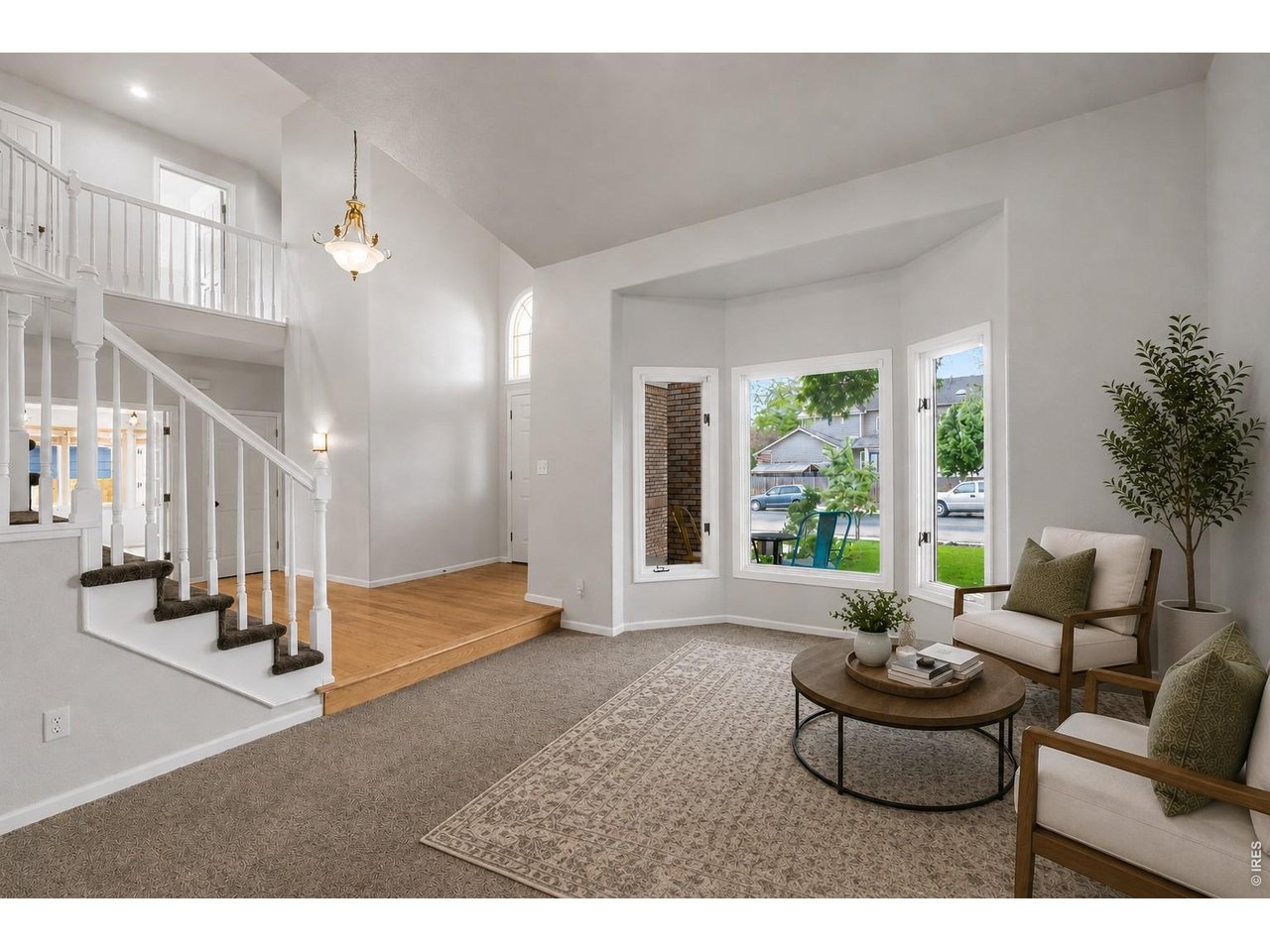 2824 Antelope Road Fort Collins, CO 80525 - Photo 2 of 32 Foyer & family room w/cathedral ceilings (virtually staged)
