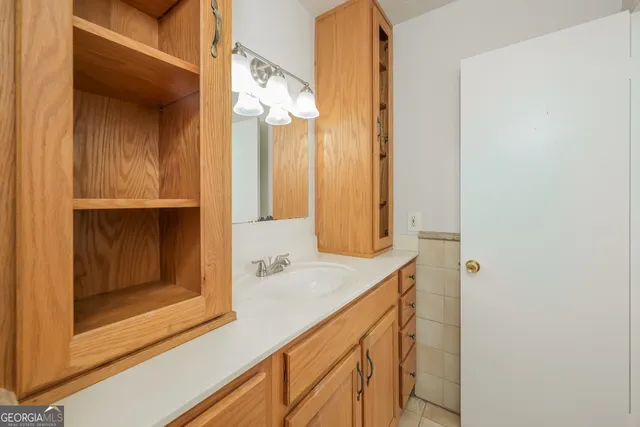 a bathroom with a sink and a mirror