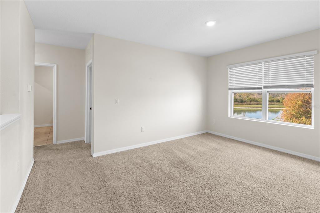 2651 Grandbury Grove Road Lakeland, FL 33811 - Photo 20 of 41 an empty room with windows