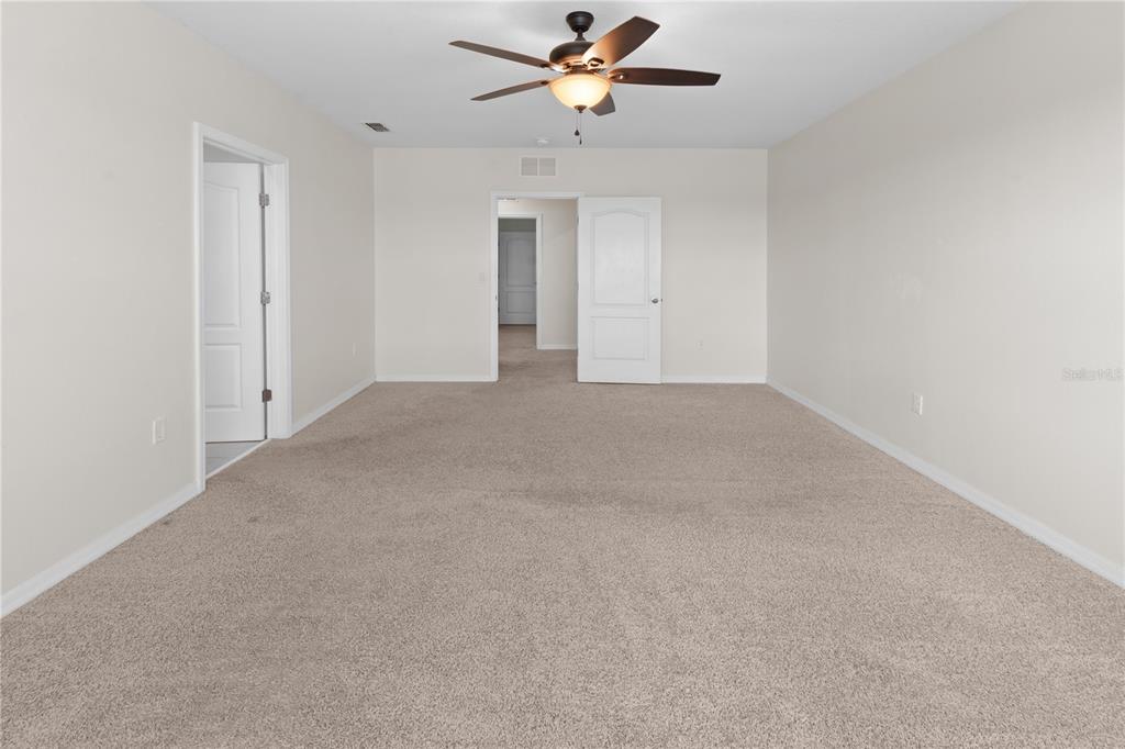 2651 Grandbury Grove Road Lakeland, FL 33811 - Photo 24 of 41 a view of a livingroom with a ceiling fan