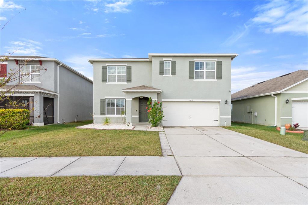 2651 Grandbury Grove Road Lakeland, FL 33811 - Photo 34 of 41 a front view of a house with a yard