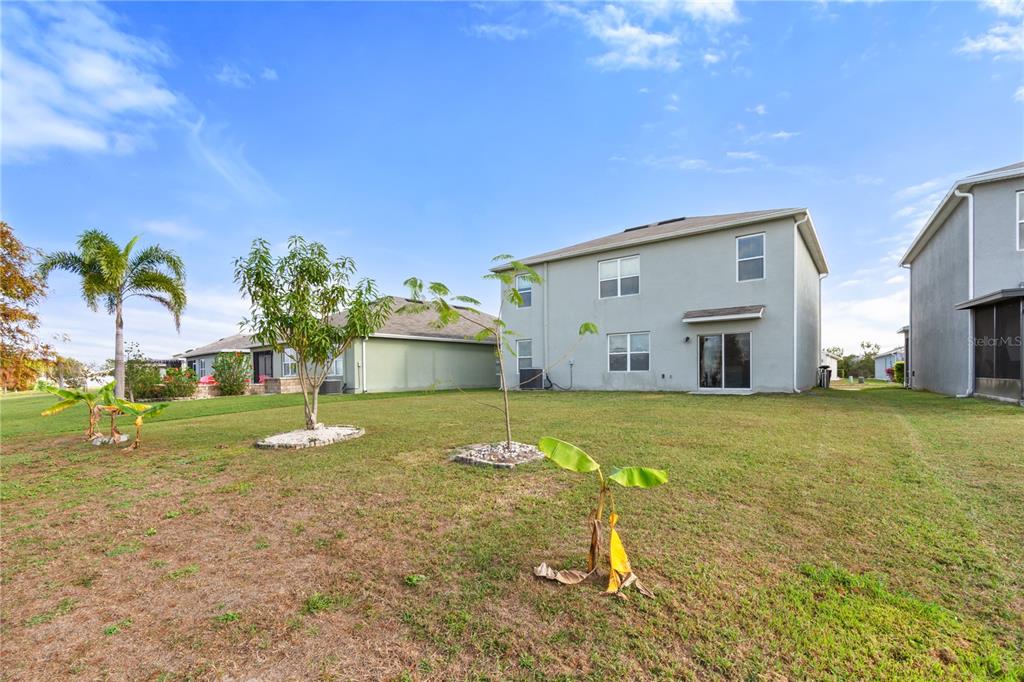 2651 Grandbury Grove Road Lakeland, FL 33811 - Photo 37 of 41 a view of a house with a yard
