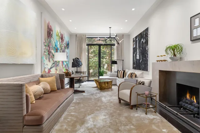 a dining room with furniture and a kitchen view