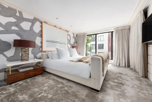 a living room with furniture fireplace and window