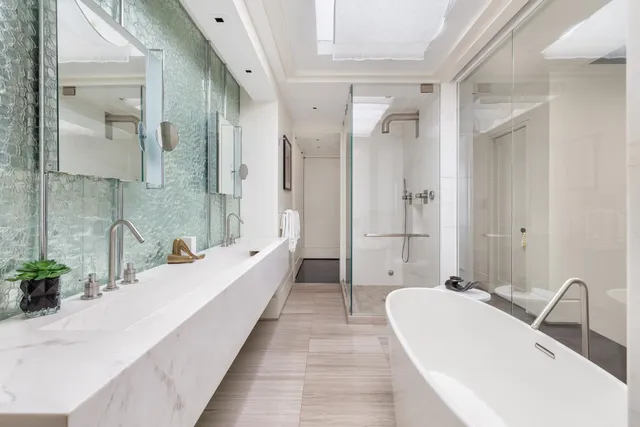 a large kitchen with stainless steel appliances granite countertop a large center island and a sink