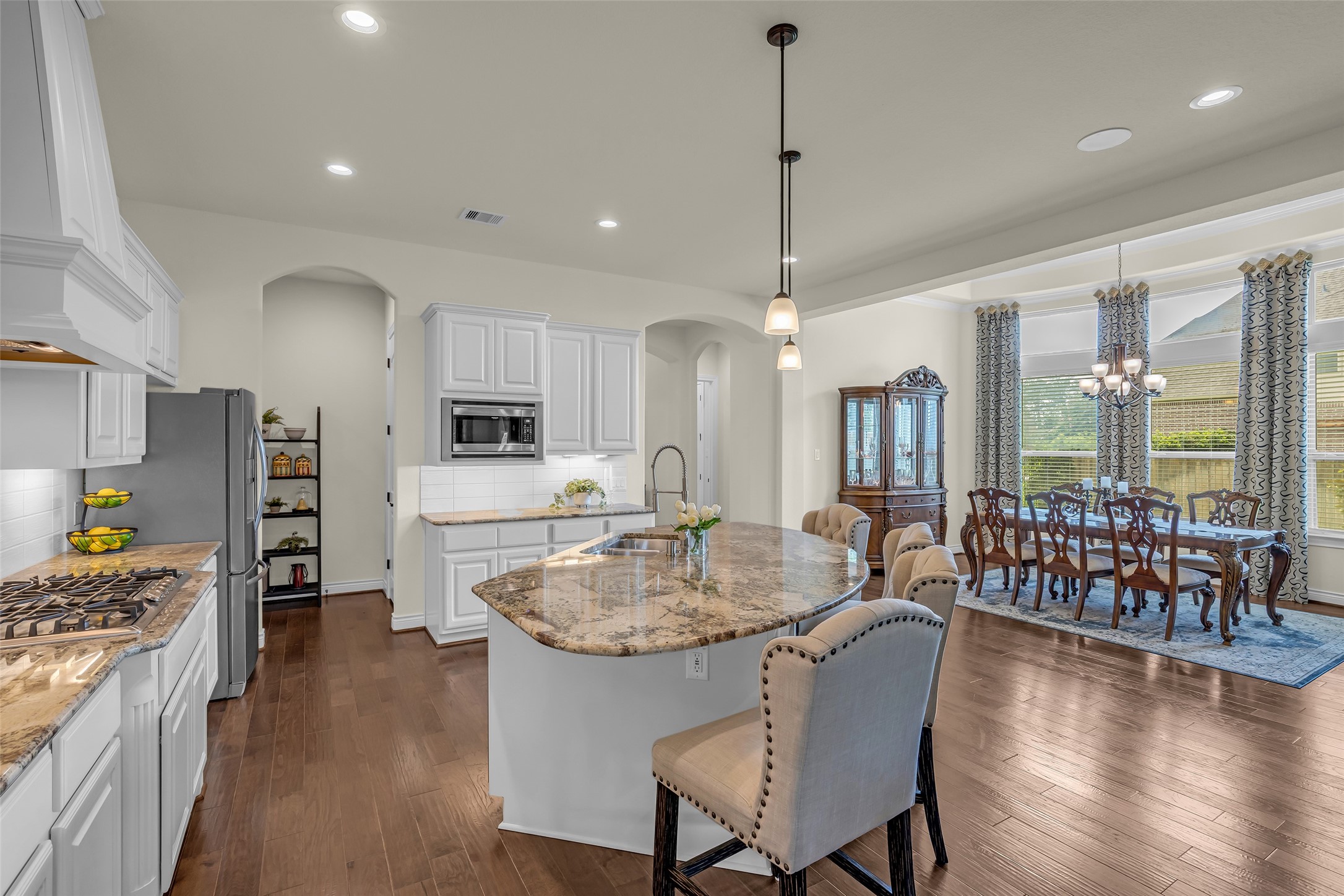 14003 South Evergreen Ridge Court Conroe, TX 77384 - Photo 12 of 43 Conveniently connected to both the formal dining room and mudroom, the island kitchen is designed for easy entertaining and daily living.