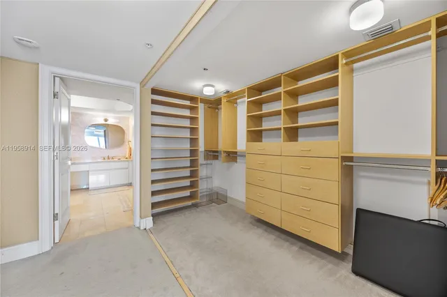 a view of walk in closet and stairs