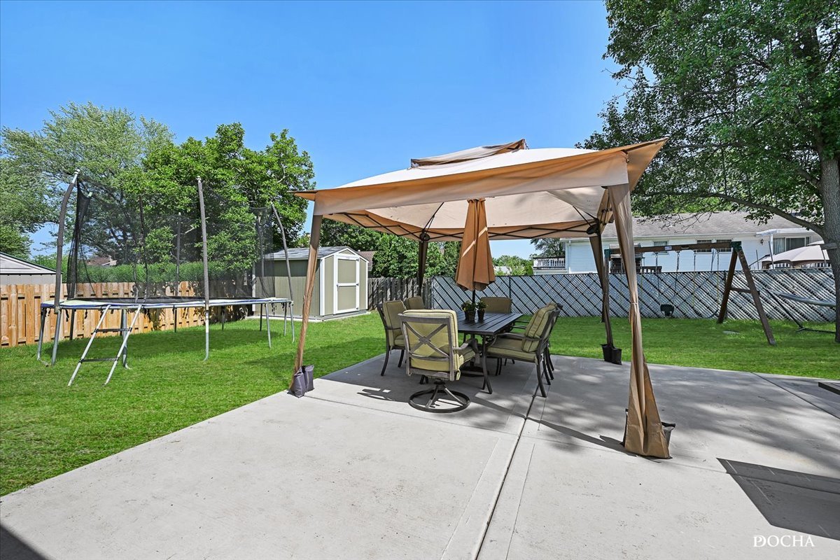 165 Stonegate Road Buffalo Grove, IL 60089 - Photo 23 of 25 a view of a chair and table in the garden