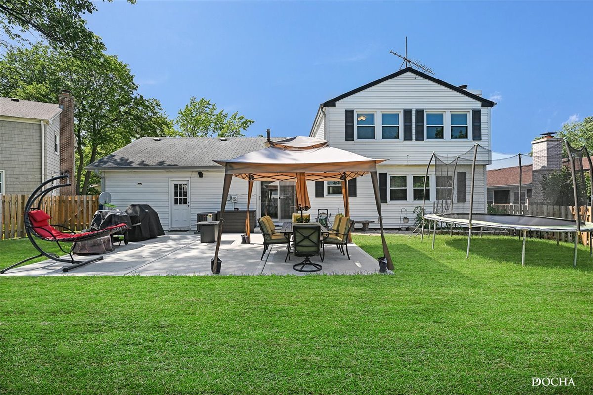 165 Stonegate Road Buffalo Grove, IL 60089 - Photo 25 of 25 a view of a house with a yard porch and sitting area
