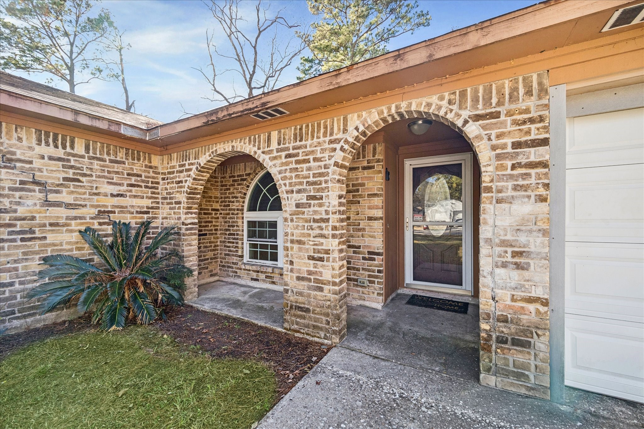 22831 Earlmist Drive Spring, TX 77373 - Photo 2 of 25 a front view of a house with a garden