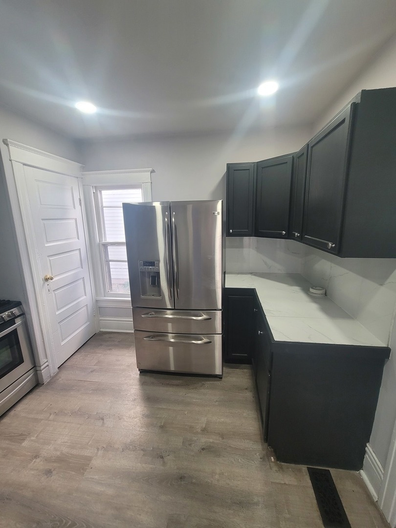 441 North View Street Aurora, IL 60506 - Photo 5 of 15 a kitchen with a refrigerator and a sink