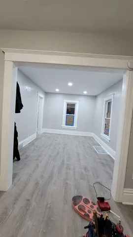a view of a hallway with a living room