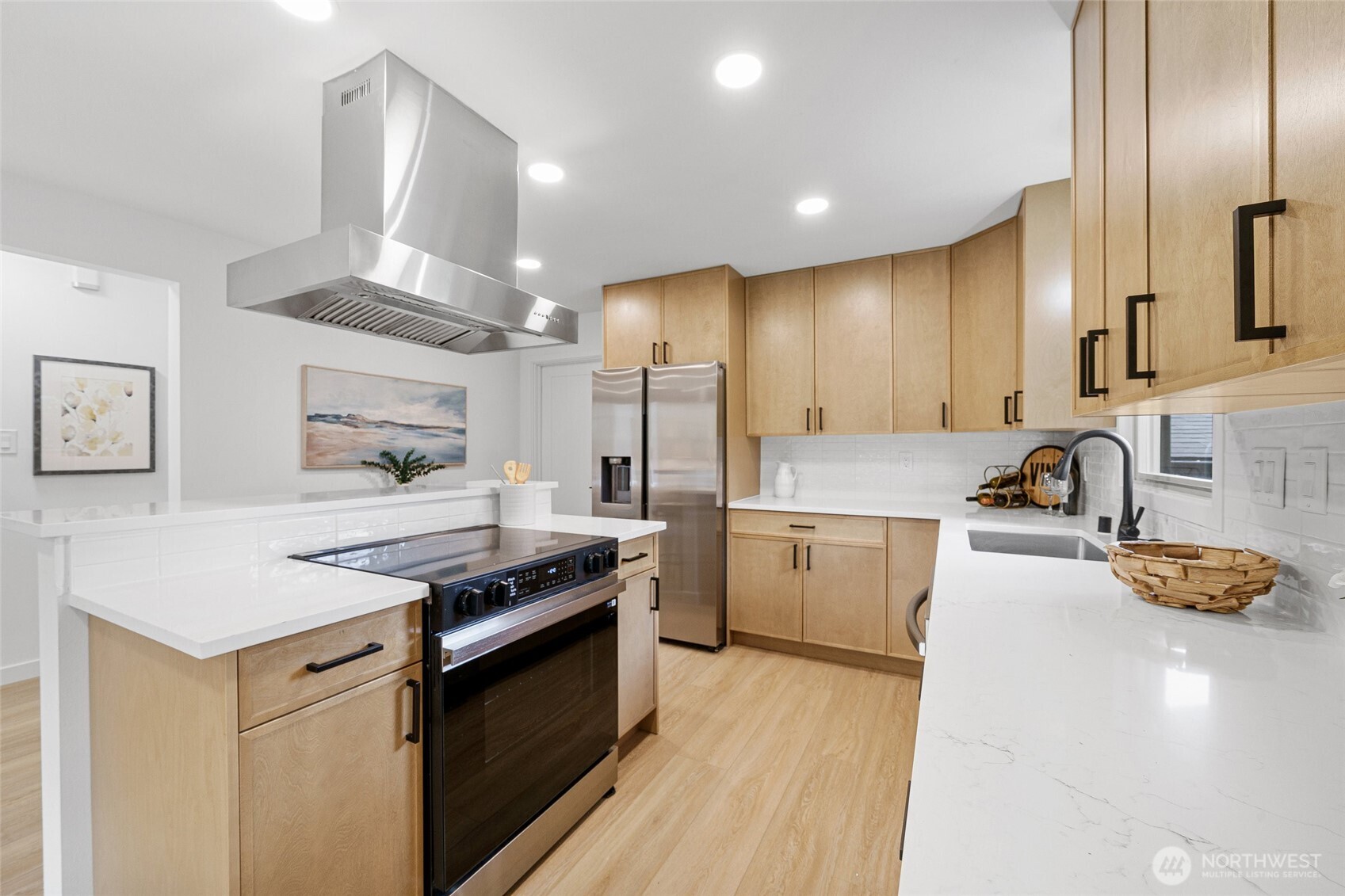 3503 Meadow Avenue North Renton, WA 98056 - Photo 13 of 29 a kitchen with stainless steel appliances granite countertop a sink stove and refrigerator
