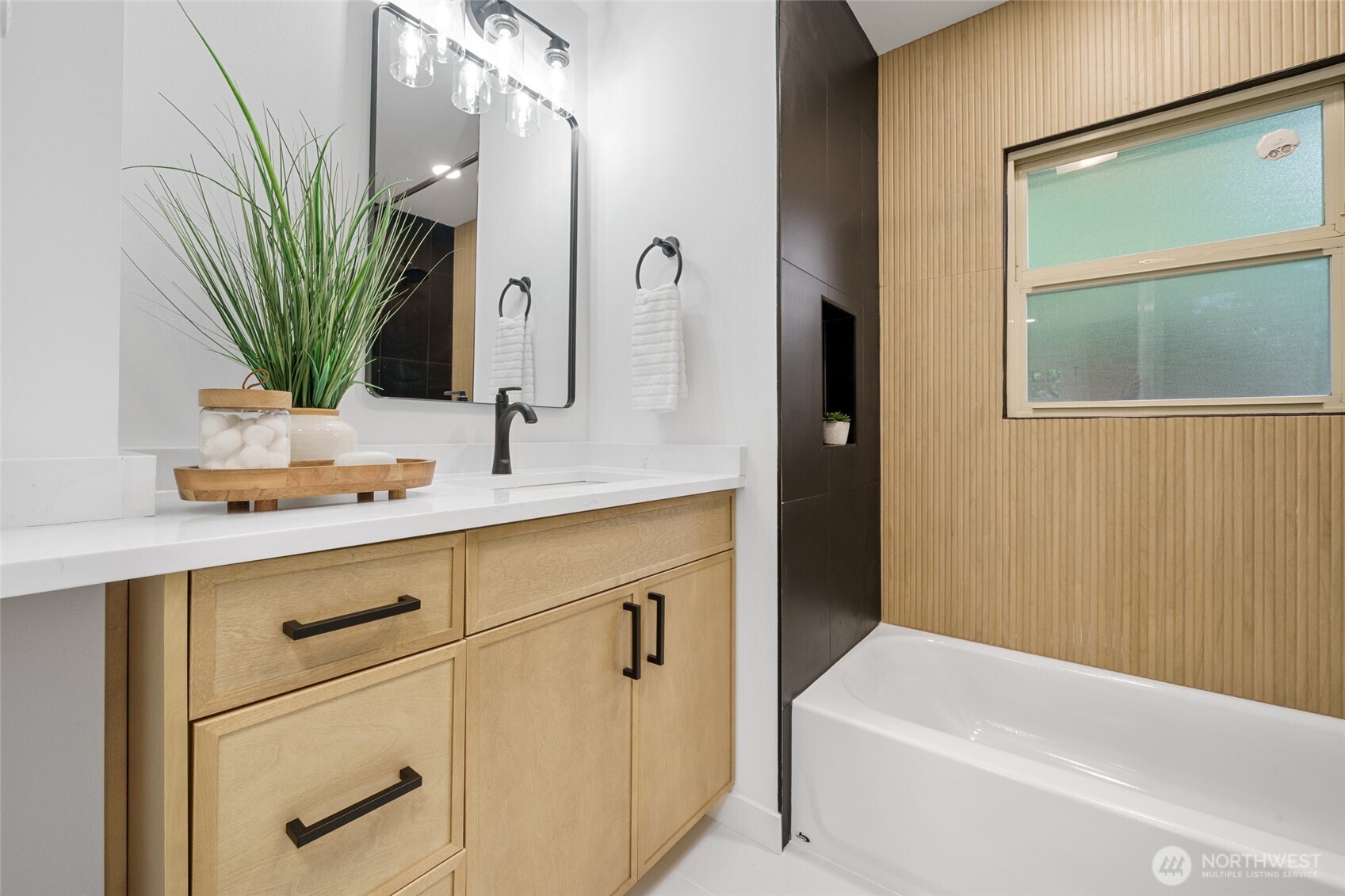 3503 Meadow Avenue North Renton, WA 98056 - Photo 17 of 29 a bathroom with a sink a bathtub and a mirror