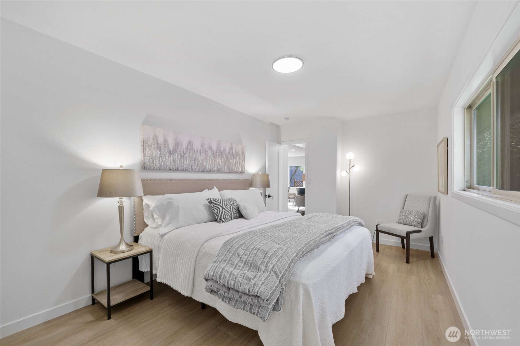 3503 Meadow Avenue North Renton, WA 98056 - Photo 20 of 29 a bedroom with a bed and a lamp with window