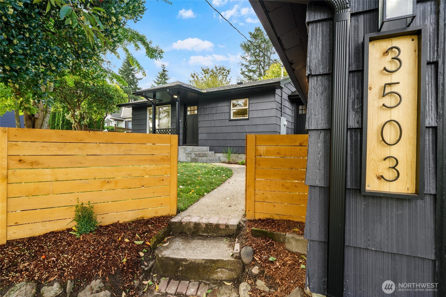 3503 Meadow Avenue North Renton, WA 98056 - Photo 3 of 29 a front view of a house with a yard
