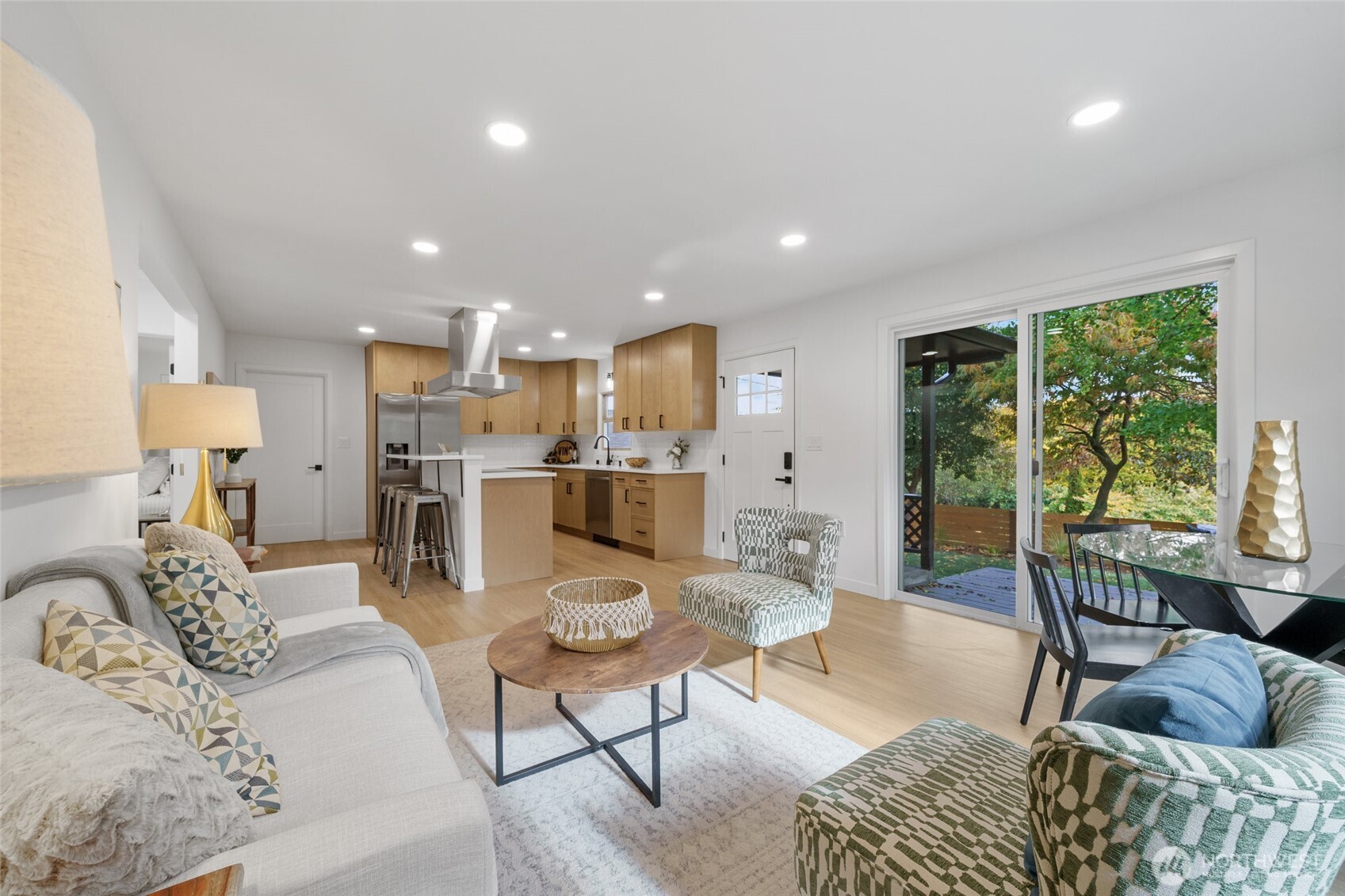 3503 Meadow Avenue North Renton, WA 98056 - Photo 9 of 29 a living room with furniture and a dining table with kitchen view