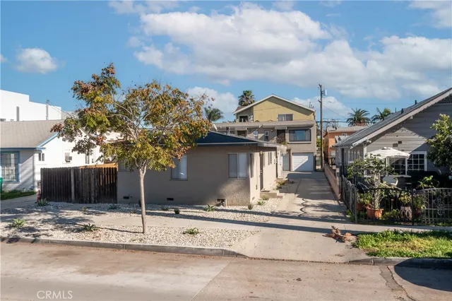 a front view of a house with a yard and a garage