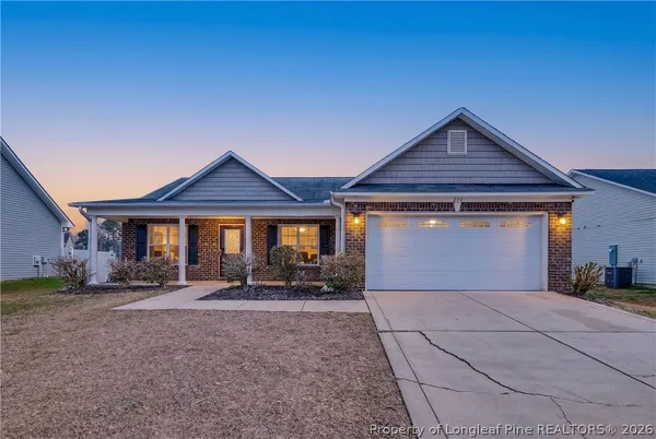a front view of a house with yard