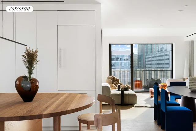 a kitchen with a table and chairs in it