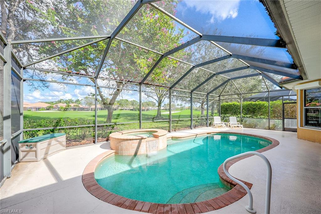 6921 Bent Grass Drive Naples, FL 34113 - Photo 29 of 48 a view of a swimming pool with a patio