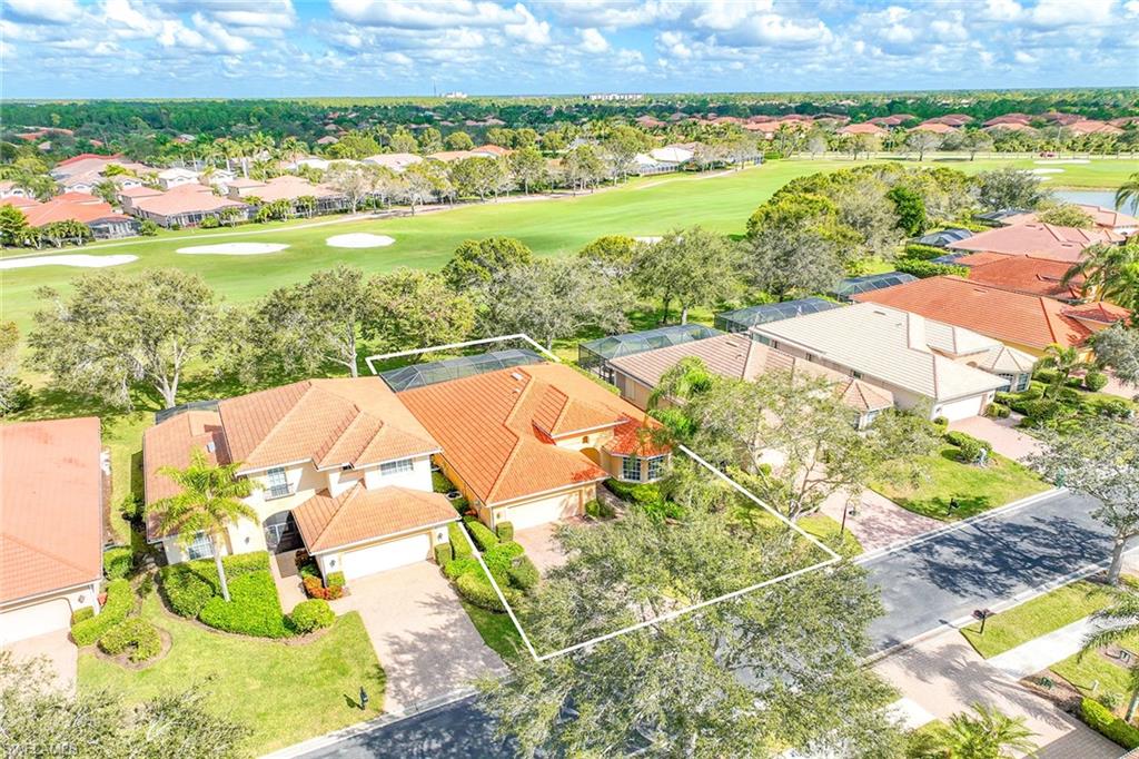 6921 Bent Grass Drive Naples, FL 34113 - Photo 36 of 48 a view of an outdoor space and a lake view