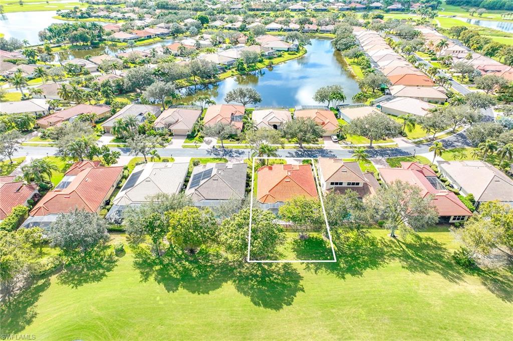 6921 Bent Grass Drive Naples, FL 34113 - Photo 37 of 48 an aerial view of residential houses with outdoor space and swimming pool