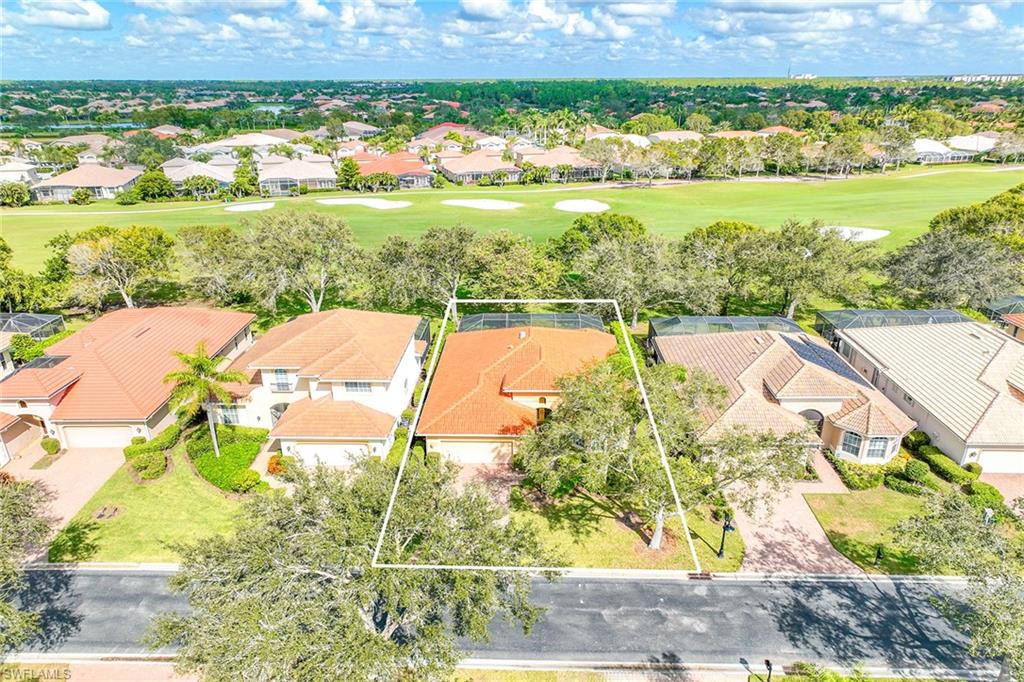 6921 Bent Grass Drive Naples, FL 34113 - Photo 4 of 48 a view of a city