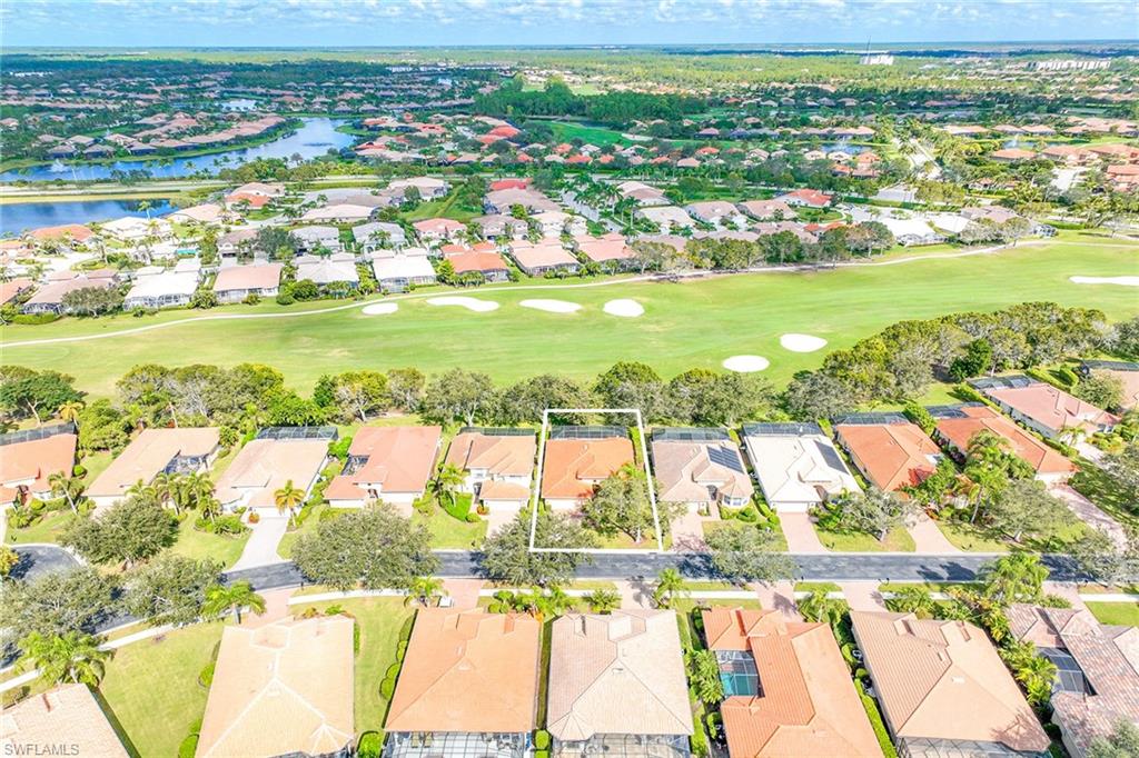 6921 Bent Grass Drive Naples, FL 34113 - Photo 41 of 48 a view of a city with an ocean view