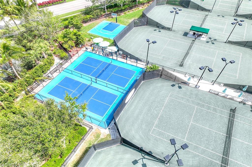 6921 Bent Grass Drive Naples, FL 34113 - Photo 48 of 48 an aerial view of a house with a yard