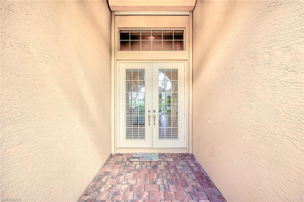 6921 Bent Grass Drive Naples, FL 34113 - Photo 5 of 48 a view of front door of house
