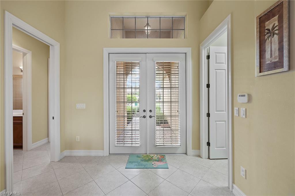 6921 Bent Grass Drive Naples, FL 34113 - Photo 6 of 48 a view of a room with windows