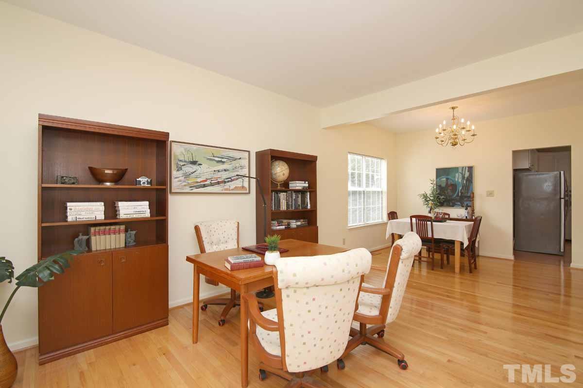 2416 Constitution Drive Raleigh, NC 27615 - Photo 11 of 25 a dining room with furniture and wooden floor