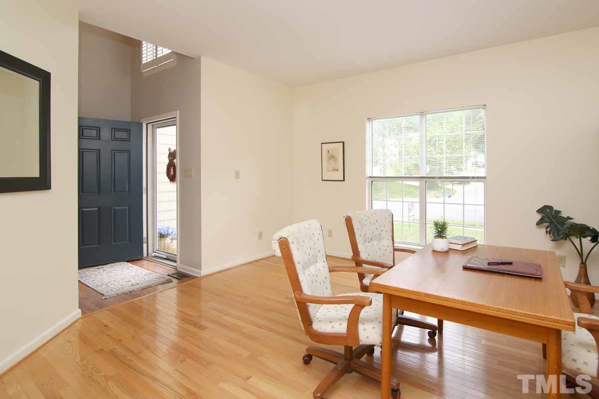 2416 Constitution Drive Raleigh, NC 27615 - Photo 12 of 25 a view of a dining room with furniture and wooden floor