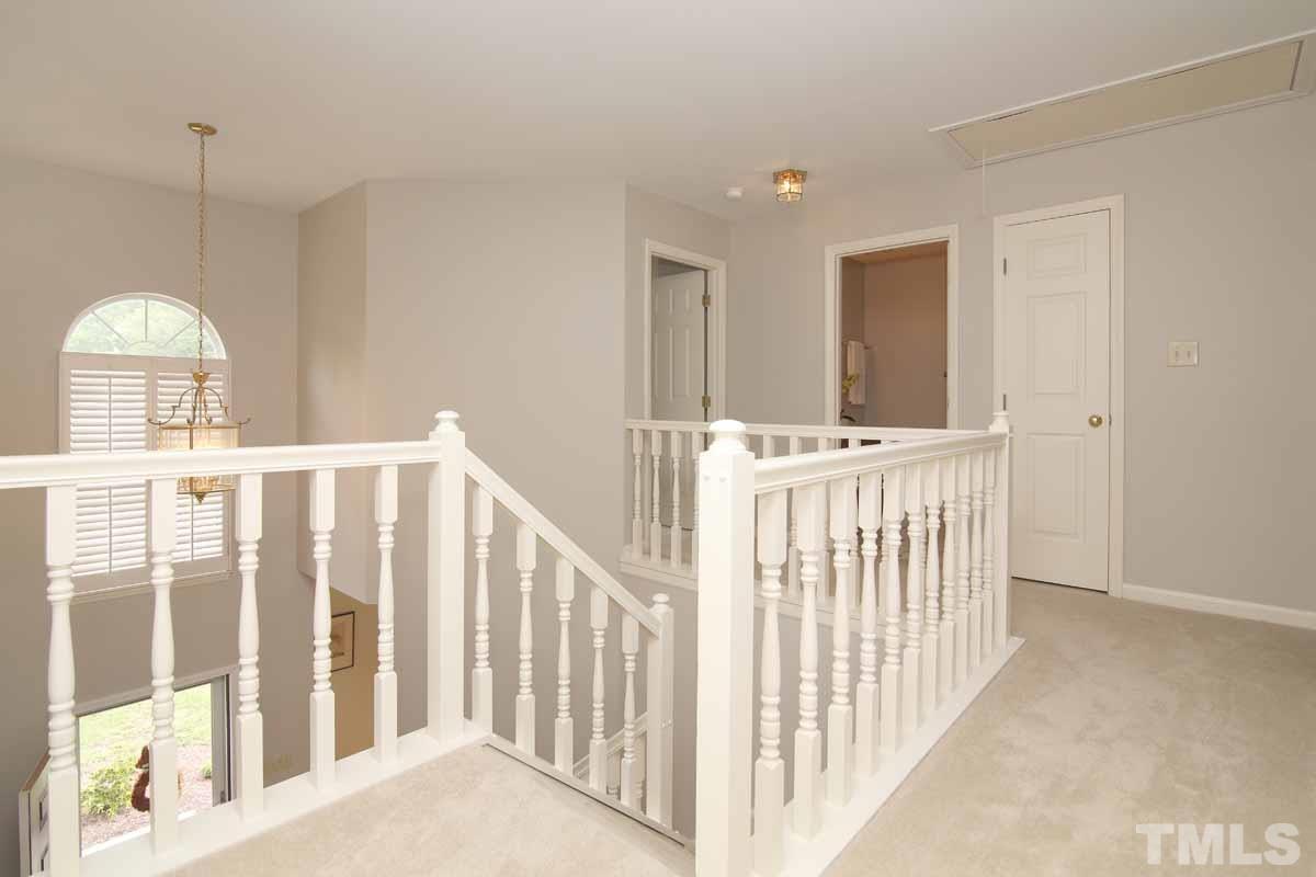 2416 Constitution Drive Raleigh, NC 27615 - Photo 13 of 25 a view of a hallway with windows