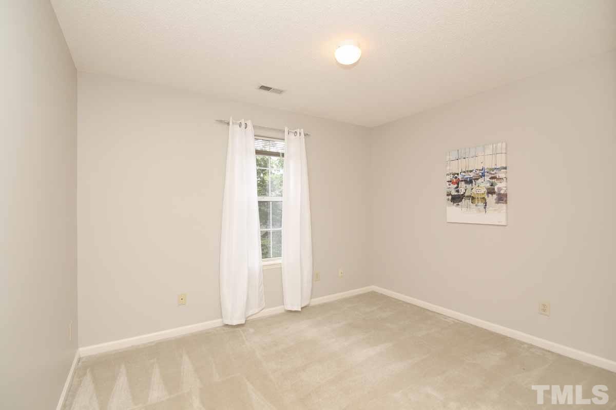 2416 Constitution Drive Raleigh, NC 27615 - Photo 20 of 25 an empty room with windows