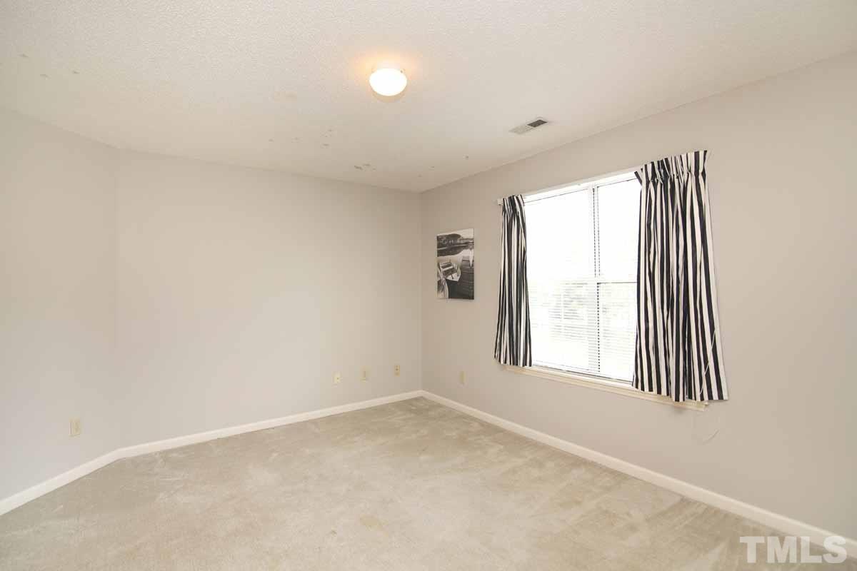 2416 Constitution Drive Raleigh, NC 27615 - Photo 22 of 25 an empty room with windows