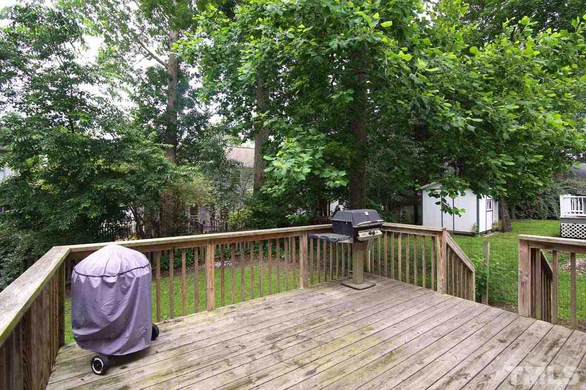 2416 Constitution Drive Raleigh, NC 27615 - Photo 25 of 25 a view of a wooden deck and a backyard
